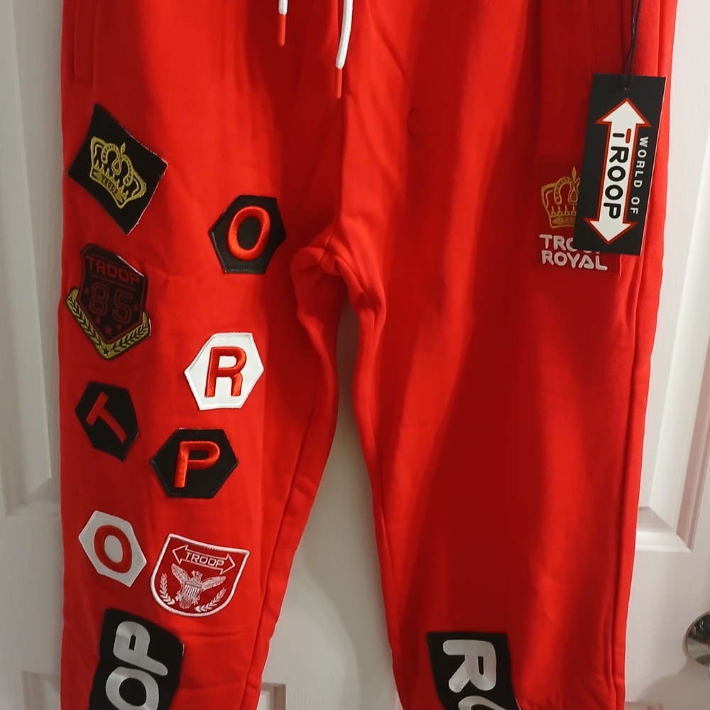 Vibrant Red Joggers with Unique Patches